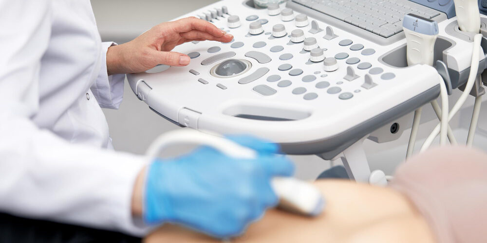 woman-getting-ultrasound-thyroid-from-doctor