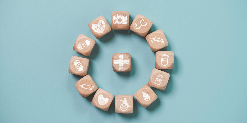 wooden-block-cube-which-print-screen-health-care-medical-icons-healthy-wellness-concept